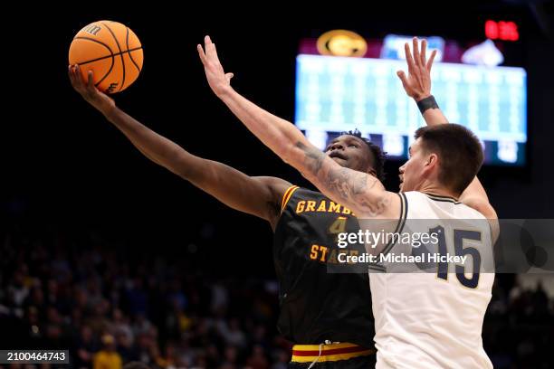 Antwan Burnett of the Grambling State Tigers shoots the ball against John Olmsted of the Montana State Bobcats during the second half in the First...