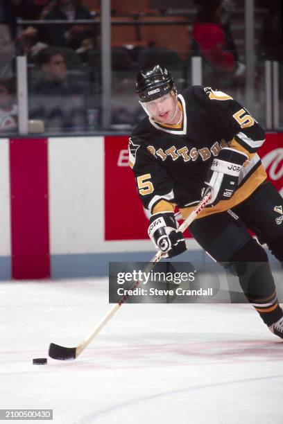 Pittsburgh Penguins defensive, Larry Murphy, carries the puck during the game against the NJ Devils at the Meadowlands Arena ,East Rutherford, NJ,...