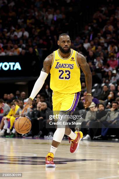 LeBron James of the Los Angeles Lakers dribbles the ball against the Sacramento Kings at Golden 1 Center on March 13, 2024 in Sacramento, California....