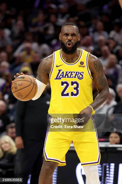 LeBron James of the Los Angeles Lakers reacts during their game against the Sacramento Kings at Golden 1 Center on March 13, 2024 in Sacramento,...