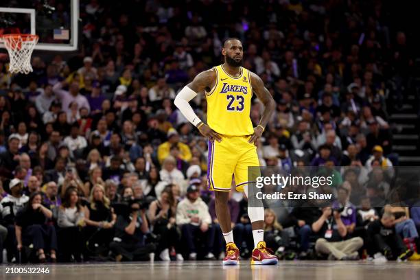 LeBron James of the Los Angeles Lakers stands on the court during their game against the Sacramento Kings at Golden 1 Center on March 13, 2024 in...