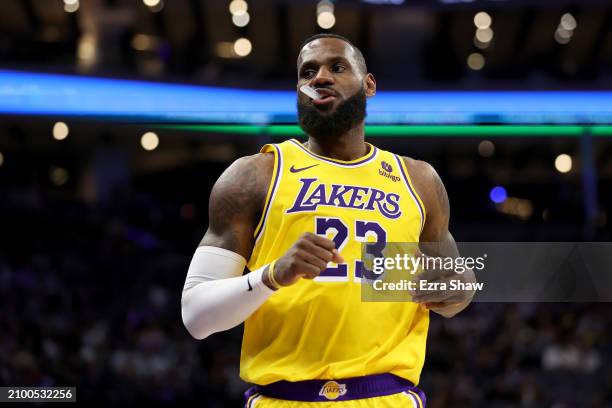 LeBron James of the Los Angeles Lakers stands on the court during their game against the Sacramento Kings at Golden 1 Center on March 13, 2024 in...