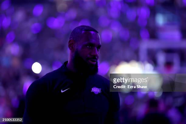LeBron James of the Los Angeles Lakers stands on the court before their game against the Sacramento Kings at Golden 1 Center on March 13, 2024 in...