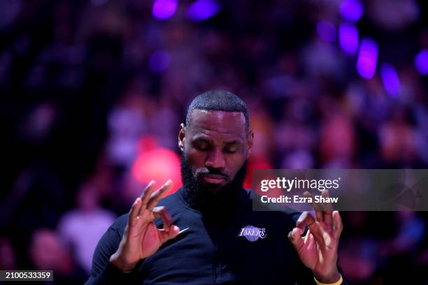 LeBron James of the Los Angeles Lakers stands on the court for the national anthem before their game against the Sacramento Kings at Golden 1 Center...