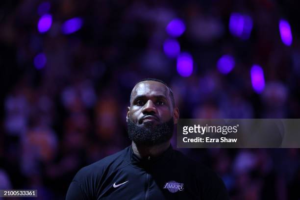 LeBron James of the Los Angeles Lakers stands on the court for the national anthem before their game against the Sacramento Kings at Golden 1 Center...