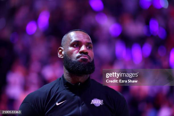 LeBron James of the Los Angeles Lakers stands on the court for the national anthem before their game against the Sacramento Kings at Golden 1 Center...