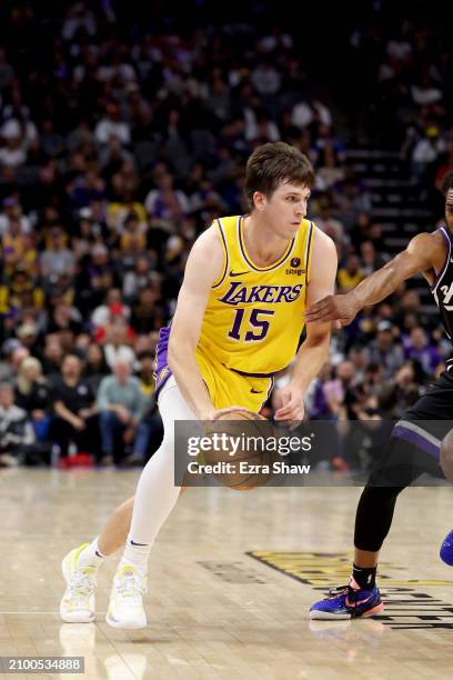 Austin Reaves of the Los Angeles Lakers dribbles the ball against the Sacramento Kings at Golden 1 Center on March 13, 2024 in Sacramento,...