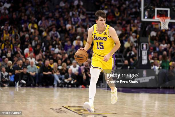 Austin Reaves of the Los Angeles Lakers dribbles the ball against the Sacramento Kings at Golden 1 Center on March 13, 2024 in Sacramento,...