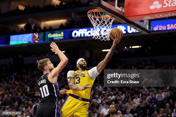 Anthony Davis of the Los Angeles Lakers dribbles the ball against the Sacramento Kings at Golden 1 Center on March 13, 2024 in Sacramento,...