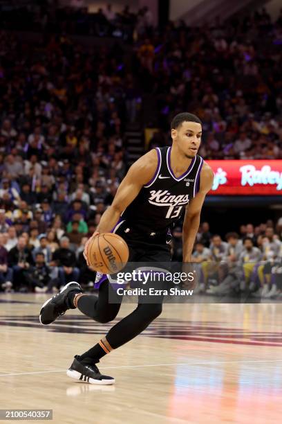 Keegan Murray of the Sacramento Kings dribbles the ball against the Sacramento Kings at Golden 1 Center on March 13, 2024 in Sacramento, California....