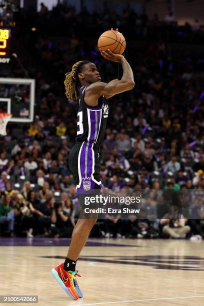 Keon Ellis of the Sacramento Kings shoots the ball against the Los Angeles Lakers at Golden 1 Center on March 13, 2024 in Sacramento, California....