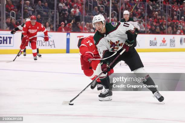 Dylan Guenther of the Arizona Coyotes plays against the Detroit Red Wings at Little Caesars Arena on March 14, 2024 in Detroit, Michigan.