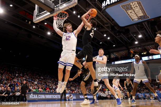 Tristan da Silva of the Colorado Buffaloes shoots the ball against Max Rice of the Boise State Broncos during the first half in the First Four game...