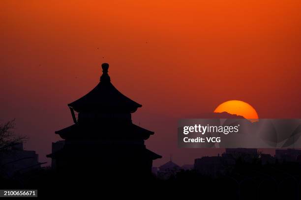 The sun goes down from the Hall of Prayer for Good Harvest at Tiantan Park on March 20, 2024 in Beijing, China. Today marks Spring Equinox , the...