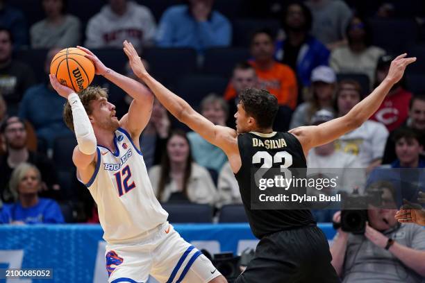 Max Rice of the Boise State Broncos shoots the ball against Tristan da Silva of the Colorado Buffaloes during the second half in the First Four game...