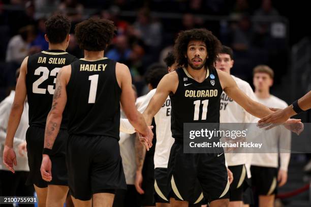 Javon Ruffin of the Colorado Buffaloes high-fives J'Vonne Hadley against the Boise State Broncos during the second half in the First Four game of the...