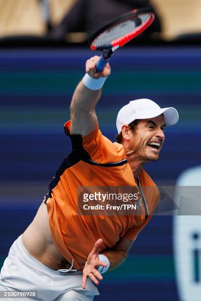 Andy Murray of Great Britain serves against Matteo Berrettini of Italy in the first round of the Miami Open at the Hard Rock Stadium on March 20,...