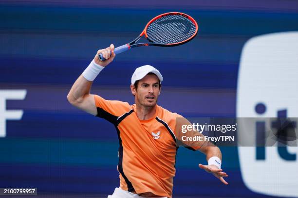 Andy Murray of Great Britain hits a forehand against Matteo Berrettini of Italy in the first round of the Miami Open at the Hard Rock Stadium on...