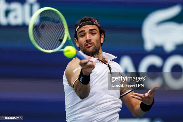 Matteo Berrettini of Italy hits a forehand against Andy Murray of Great Britain in the first round of the Miami Open at the Hard Rock Stadium on...