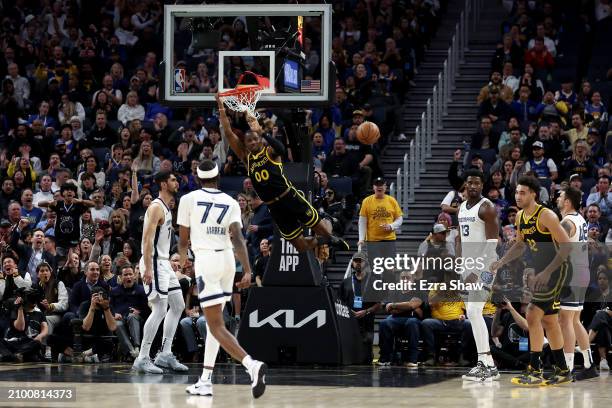 Jonathan Kuminga of the Golden State Warriors dunks the ball against the Memphis Grizzlies in the second half at Chase Center on March 20, 2024 in...