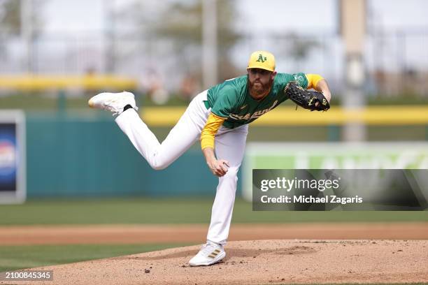 Paul Blackburn of the Oakland Athletics pitches during a spring training game against the San Francisco Giants at HoHoKam Stadium on February 28,...