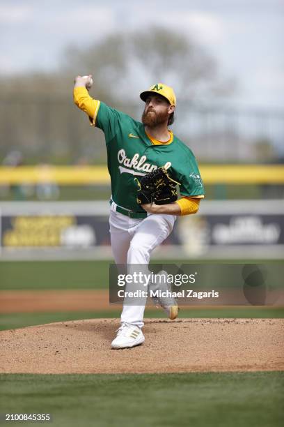 Paul Blackburn of the Oakland Athletics pitches during a spring training game against the San Francisco Giants at HoHoKam Stadium on February 28,...