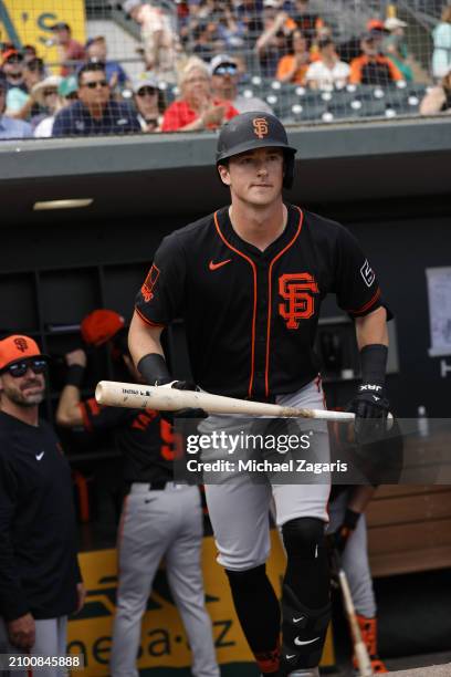 Tyler Fitzgerald of the San Francisco Giants in the dugout before a spring training game against the Oakland Athletics at HoHoKam Stadium on February...