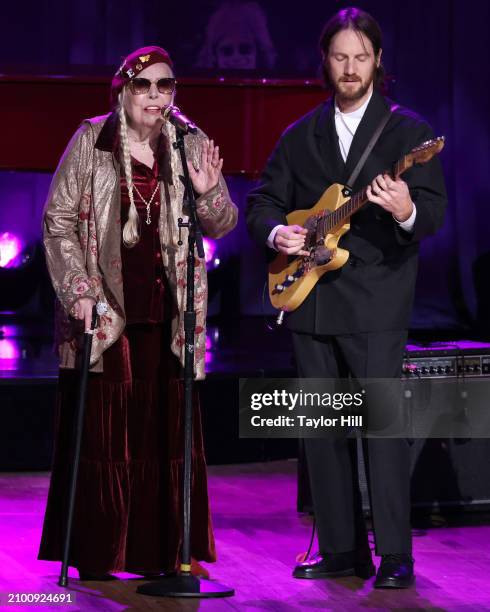 Joni Mitchell and Blake Mills perform during the 2024 Gershwin Prize for Popular Song presentation to Elton John and Bernie Taupin by the Library of...