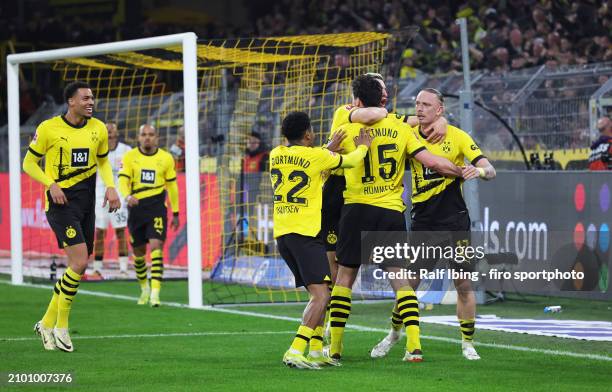 Mats Hummels of Borussia Dortmund celebrates with teammates after scoring his teams second goal during the Bundesliga match between Borussia Dortmund...