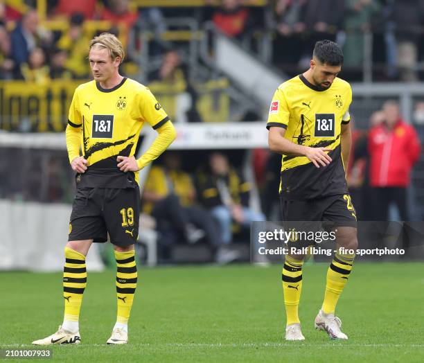 Julian Brandt of Borussia Dortmund and teammate Emre Can look dejected during the Bundesliga match between Borussia Dortmund and Eintracht Frankfurt...