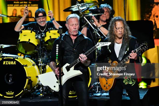 Drummer Lars Ulrich, guitarist and lead singer James Hetfield, and guitarist Kirk Hammett of the band Metallica perform at the 2024 Library of...