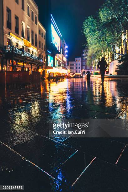 christmas lights on a rainy evening in central london, united kingdom - tradition town square stock pictures, royalty-free photos & images