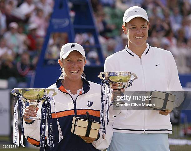 Lindsay Davenport and Lisa Raymond both of the USA pose with their trophies after their victory over Jennifer Capriati of USA and Magui Serna of...