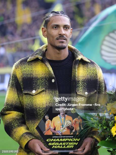 Sebastian Haller of BVB honored for Africa Cup championship before the Bundesliga match between Borussia Dortmund and Eintracht Frankfurt at Signal...