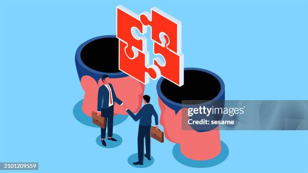 ideas for business partnerships, finding partners, teamwork, team management & management science, isometric two businessmen standing under a brain-connecting jigsaw puzzle shaking hands - memory stock illustrations
