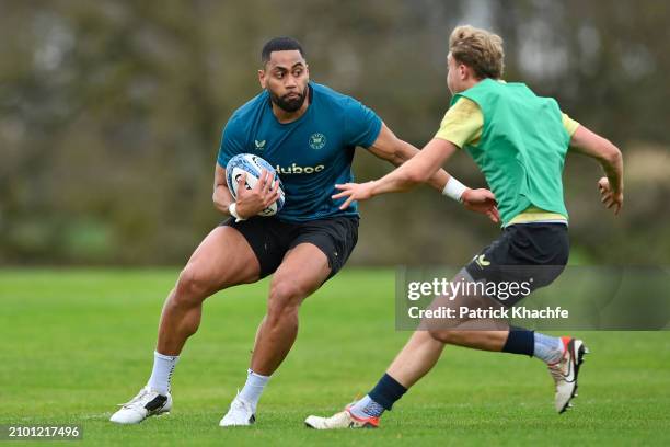 Joe Cokanasiga of Bath Rugby with the ball during a Bath Rugby training session at Farleigh House on March 20, 2024 in Bath, England.