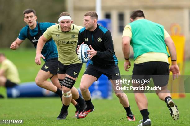 Finn Russell of Bath Rugby with the ball during a Bath Rugby training session at Farleigh House on March 20, 2024 in Bath, England.