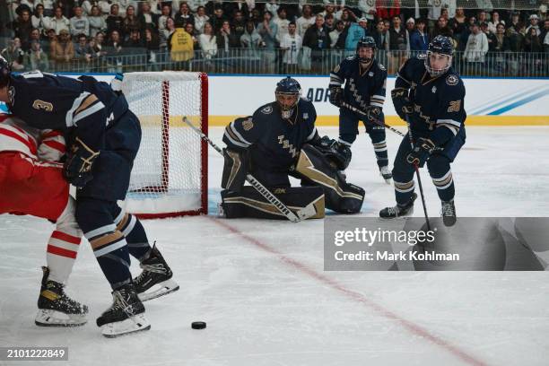 Devon Bobak of the Trinity College Bantams tracks the puck during the Division III Men's Ice Hockey Championship held at Koeppel Community Center on...