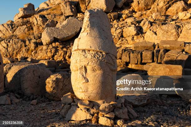 monumental head of king antiochus at sunset, mount nemrut in turkey,unesco - sand sculpture stock pictures, royalty-free photos & images