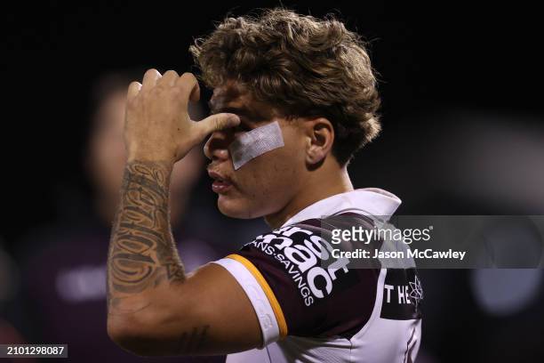 Reece Walsh of the Broncos looks on from the sideline during the round three NRL match between Penrith Panthers and Brisbane Broncos at BlueBet...
