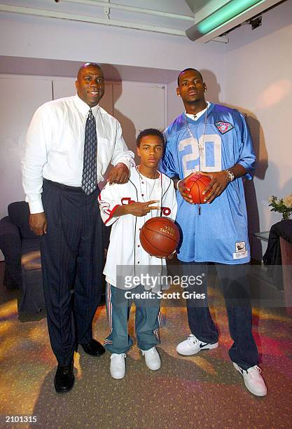 Magic Johnson, Bow Wow, and LeBron James pose for a photo backstage during MTV's Total Request Live June 18, 2003 at the MTV Times Square Studios in...