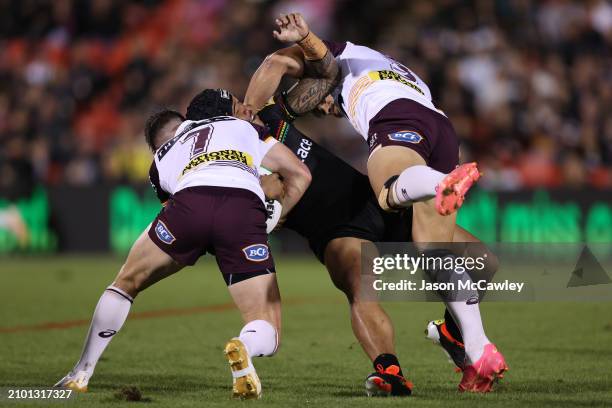 Brian To'o of the Panthers is tackled by Jock Madden of the Broncos during the round three NRL match between Penrith Panthers and Brisbane Broncos at...