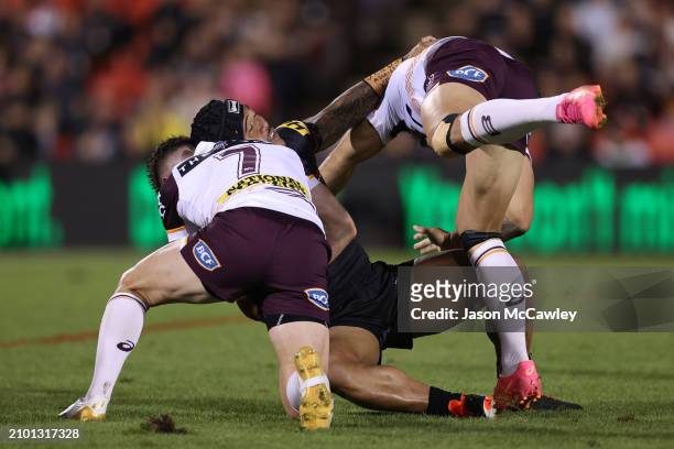 Brian To'o of the Panthers is tackled by Jock Madden of the Broncos during the round three NRL match between Penrith Panthers and Brisbane Broncos at...