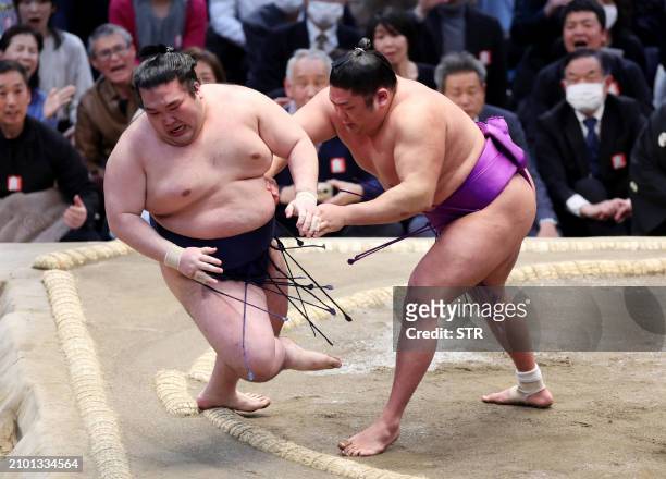 No. 17 maegashira-ranked sumo wrestler Takerufuji pushes down sixth-ranked Gonoyama to finish with a 13-2 record on the final day to win the 15-day...