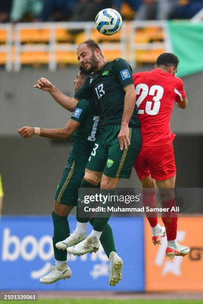 Farred Ullah of team Pakistan jumps to save the ball from Ehsan Manel of team Jordan during the 2026 FIFA World Cup Qualifiers second round Group G...