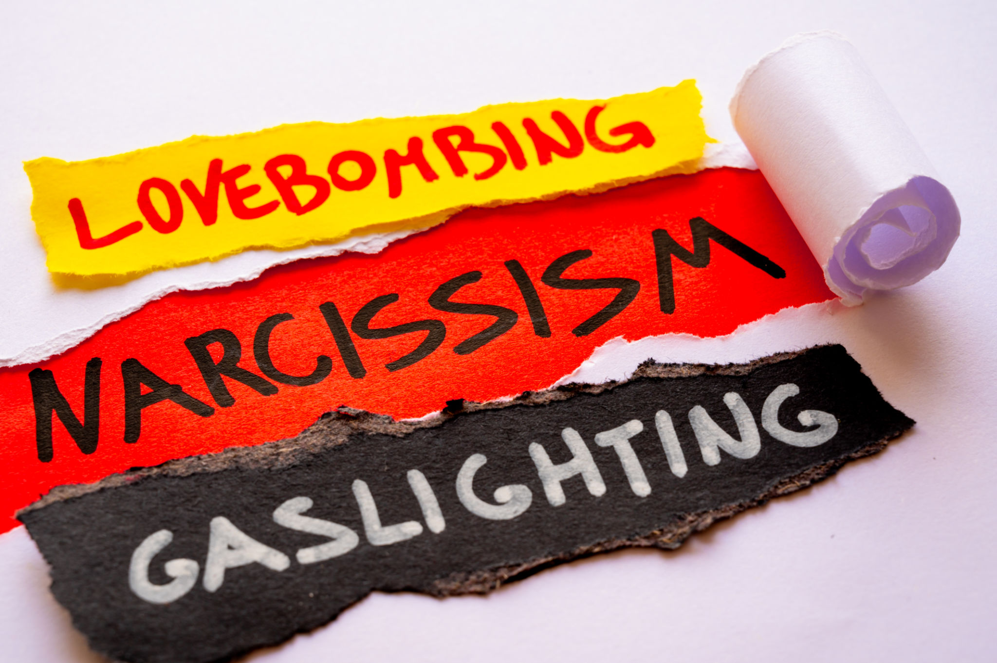 Word Narcissism on red surface. Word Narcissism on red surface.