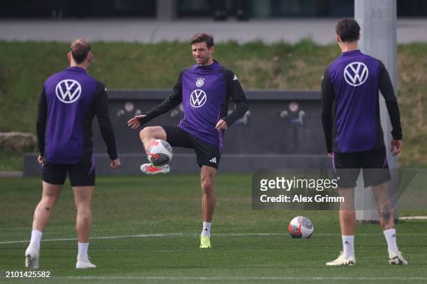 Thomas Mueller controls the ball during a training session of the German national soccer team at DFB-Campus on March 21, 2024 in Frankfurt am Main,...