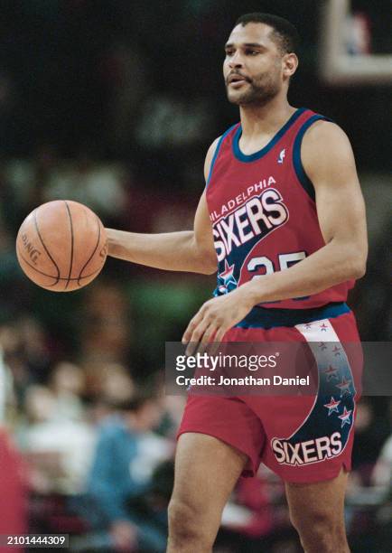 Jeff Malone, Shooting Guard for the Philadelphia 76ers in motion dribbling the basketball down court during the NBA Central Division basketball game...