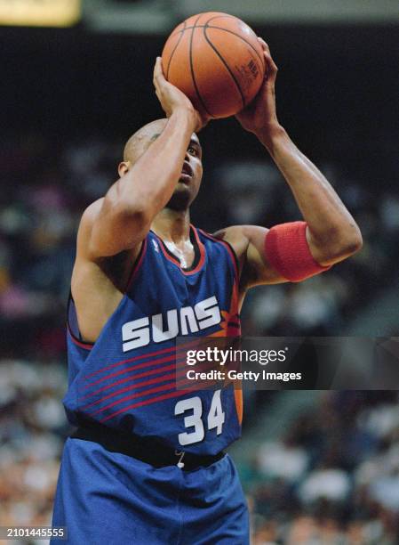 Charles Barkley, Power Forward and Small Forward for the Phoenix Suns prepares to shoot a free throw during the NBA Atlantic Division basketball game...