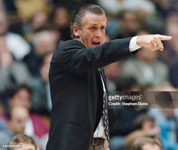 Pat Riley, Head Coach for the Miami Heat points and shouts out instructions from the sideline during the NBA Pacific Division basketball game against...